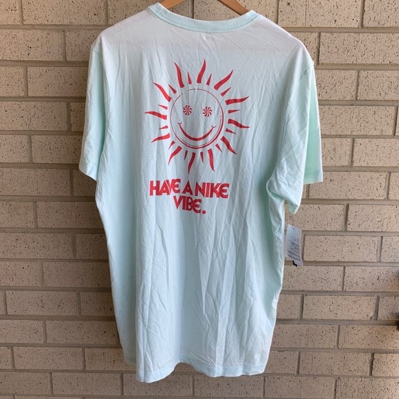 teal and pink nike shirt